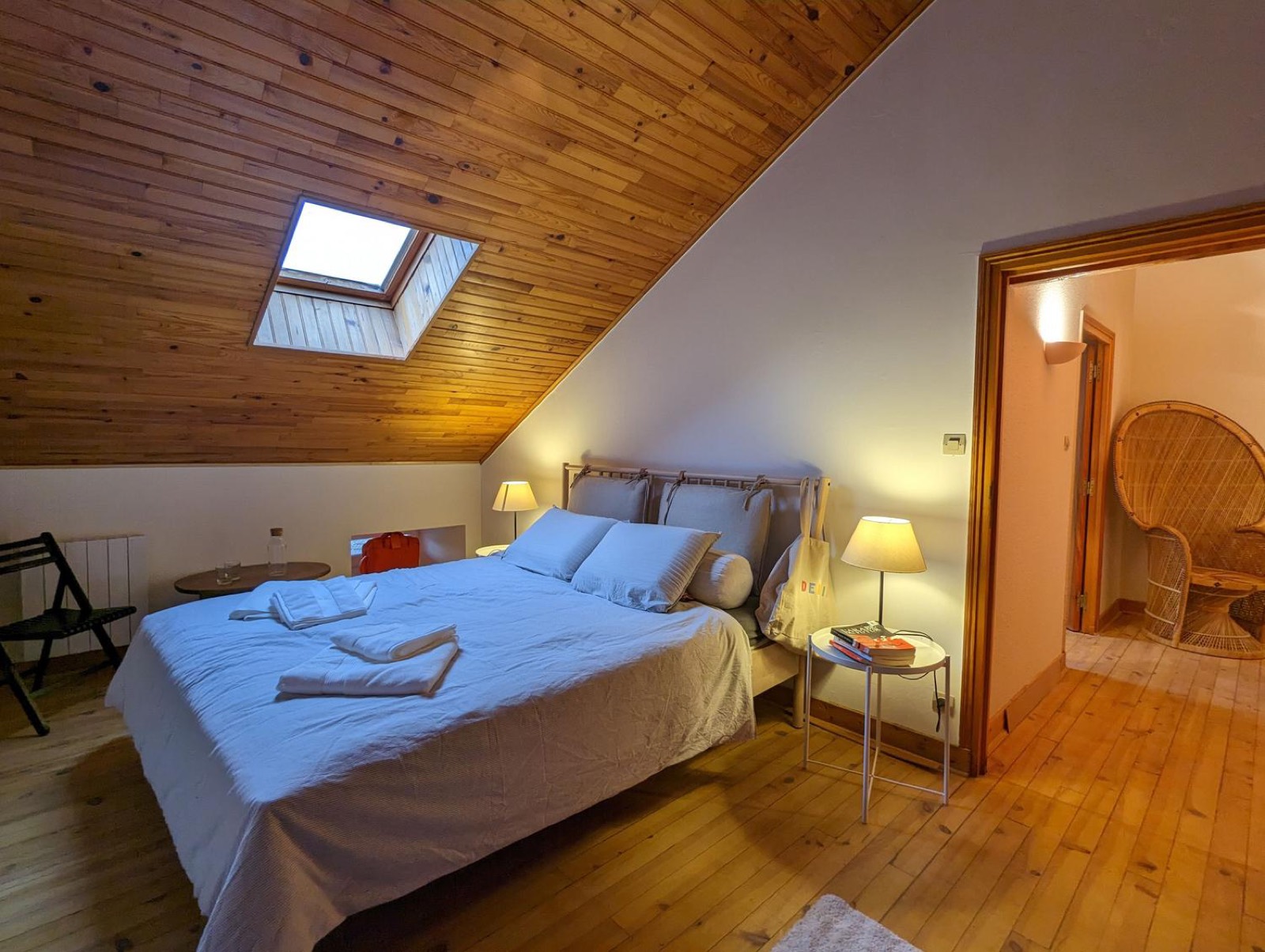 Bedroom under the eaves, wooden ceiling