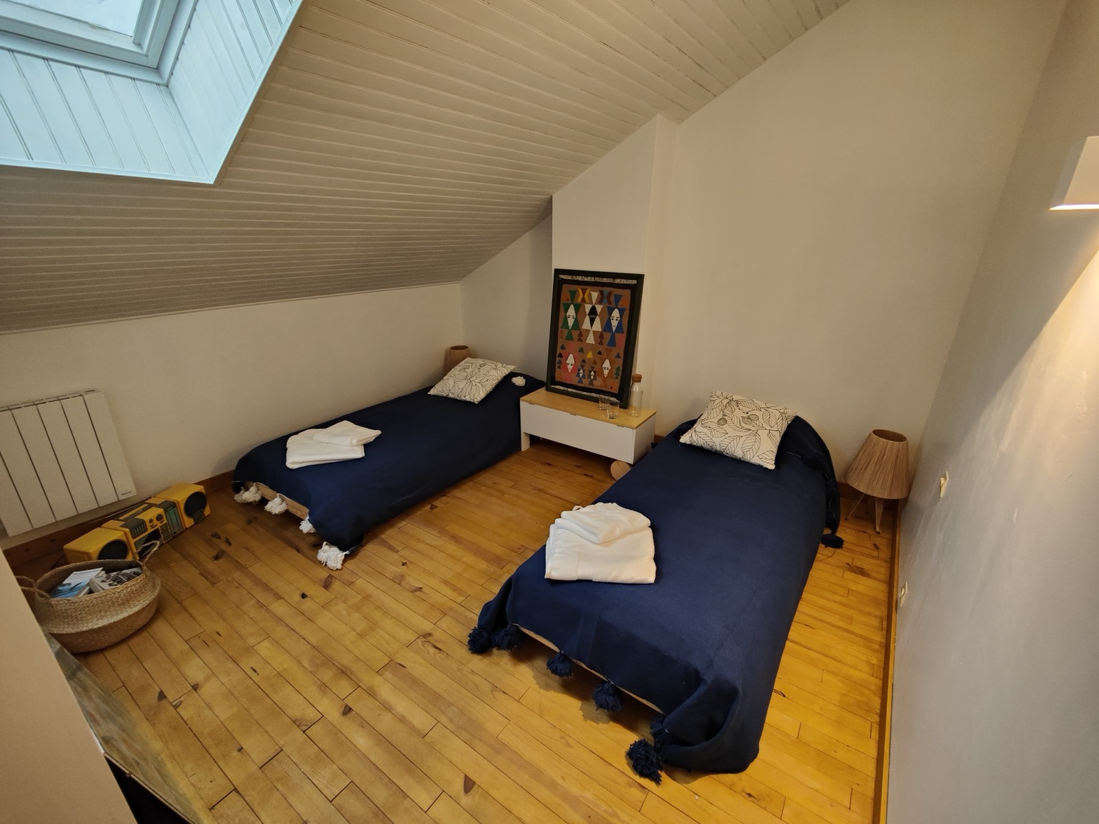 Bedroom with two navy twin beds