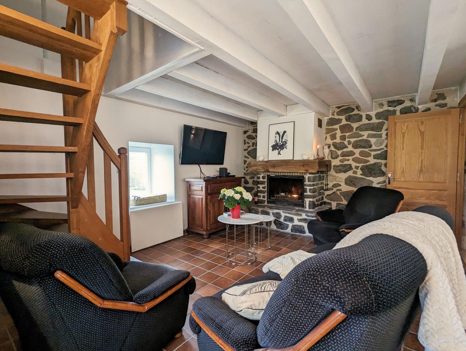 Second living room with television and fireplace